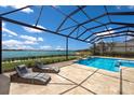 This beautiful property features a screened-in pool with a lake view, perfect for outdoor enjoyment at 508 Blue Shell Loop, Sarasota, FL 34240