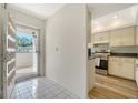 A well-lit kitchen with stainless steel appliances adjacent to the entryway at 5269 Wedgewood Ln # 36, Sarasota, FL 34235