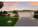 Charming single-story home with a manicured lawn and a side entry two-car garage at 5782 Sandy Pointe Dr, Sarasota, FL 34233