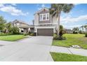 Inviting two-story home featuring well-manicured landscaping and a spacious driveway, creating a warm welcome at 5978 Anise Dr, Sarasota, FL 34238
