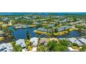 Beautiful aerial view of a waterfront property with a serene backyard and surrounding greenery at 11116 Sanctuary Dr, Bradenton, FL 34209