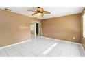 Spacious living room with white tile floors and neutral-toned walls at 1401 Francis Ave, Sarasota, FL 34232