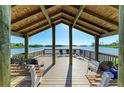 Charming waterfront gazebo featuring ample seating to enjoy the lovely views at 1617 Bayhouse Ct # 121, Sarasota, FL 34231