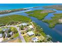 Aerial shot showing the home's waterfront position, canal access, and proximity to the bay at 1680 Lemon Bay Dr, Venice, FL 34293