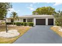 Beautiful single story home with an attached garage and well-maintained landscaping at 624 Fort Duquesna Dr, Sun City Center, FL 33573