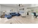 Bright and airy living room with modern furniture and access to the outdoor pool at 8420 43Rd Avenue W Dr, Bradenton, FL 34209
