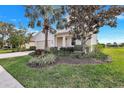 Well maintained single Gathering home surrounded by mature trees and green lawn at 8603 River Preserve Dr, Bradenton, FL 34212