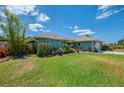 Inviting single-Gathering home with lush landscaping, mature trees, and a well-maintained lawn in a desirable neighborhood at 9321 New Martinsville Ave, Englewood, FL 34224
