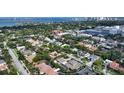 Sweeping aerial captures the home's idyllic neighborhood location near the bay and downtown at 1910 Datura St, Sarasota, FL 34239