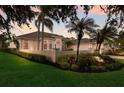 Charming single Gathering home with a lush green lawn and mature landscaping at 2301 Little Country Rd, Parrish, FL 34219