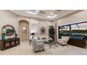 Bright living room with a large window and a view of the pool at 2301 Little Country Rd, Parrish, FL 34219