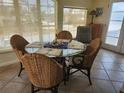 Bright dining area with large windows, a glass table, and seating for five at 300 N 22Nd St, Bradenton Beach, FL 34217