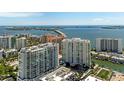 Breathtaking aerial view of waterfront condos with bridge access to surrounding coastal areas at 301 Quay Commons # 1709, Sarasota, FL 34236