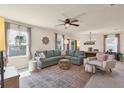 Bright and airy living room with a large sectional sofa and modern decor at 309 Blue Point Dr, Ruskin, FL 33570