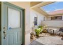 Inviting front porch showcasing seating area and a cozy outdoor space at 3412 E Chelmsford Ct # 42, Sarasota, FL 34235
