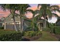 Beautiful single-story home with mature landscaping and a warm, inviting entrance at 4016 Azurite Way, Bradenton, FL 34211