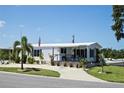 Welcoming single-story home with a cozy front porch and freshly landscaped yard at 4111 E 13Th E St, Ellenton, FL 34222