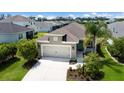 Charming single-Gathering home with a lush green lawn and a well-maintained two-car garage with great curb appeal at 4815 Deep Creek Ter, Parrish, FL 34219