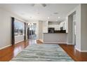 Open-concept living room featuring hardwood floors, neutral paint, and large windows for natural light at 5227 Aqua Breeze Dr, Bradenton, FL 34208