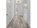 Bright foyer featuring sleek floors, white walls, and a glass-paneled front door at 532 Yale Rd, Venice, FL 34293