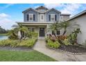 Inviting front entrance with vibrant landscaping and a well-maintained walkway at 6001 Anise Dr, Sarasota, FL 34238