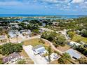 Panoramic aerial view of a charming neighborhood with single-Gathering homes and waterfront access at 612 Shore Rd, Nokomis, FL 34275