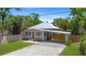 Charming single Gathering home with a metal roof, carport and fenced yard at 815 Hand Ave, Sarasota, FL 34232