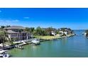 Waterfront property with a boat dock offering scenic views of boats and waterfront community at 975 Whitakers Ln, Sarasota, FL 34236