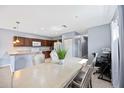 The dining area combines the kitchen, dining, and living space for seamless entertainment and Gathering gatherings at 1122 42Nd E Ter, Bradenton, FL 34208