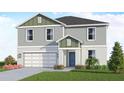 Charming two-story home with a gray-green exterior, a two-car garage, and freshly landscaped front yard at 13016 Cedar Elm Lane, Parrish, FL 34219