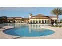 Resort-style pool area with a large pool and seating, ideal for community gatherings at 13587 Vancanza Dr, Venice, FL 34293