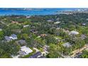 Picturesque aerial view showcasing the home's location amidst lush greenery and a stunning waterfront backdrop at 1773 South Dr, Sarasota, FL 34239
