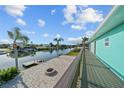 Stunning waterfront views from the backyard featuring a canal and boat dock at 3416 Crape Myrtle Dr, Hernando Beach, FL 34607