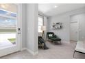 Comfortable living room with stylish decor and modern furnishings by the front door at 4008 Antelope Ter, North Port, FL 34286