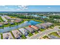Aerial view showcases this home's premium lot with water view and easy access to the community pool, nature, and walking trails at 6203 Grandview Hill Ct, Bradenton, FL 34203