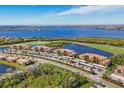 Beautiful aerial shot of condos with golf course, water views, parking and lots of green space at 6509 Grand Estuary Trl # 203, Bradenton, FL 34212