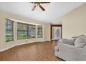 Inviting living room with abundant natural light from the bay window and wood-look flooring at 1143 131St E St, Bradenton, FL 34212