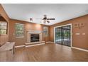 Cozy living room with a decorative fireplace and sliding doors leading to the pool area at 1143 131St E St, Bradenton, FL 34212