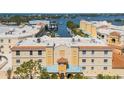 Exterior shot showcasing the building's architecture, multiple windows, and rooftop details at 14041 Bellagio Way # 218, Osprey, FL 34229