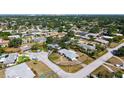 Aerial view showcasing the property within a lush, established neighborhood at 2702 Bedford Way, Sarasota, FL 34239