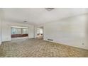 Spacious living room with neutral carpet, offering a blank canvas for new homeowners at 2702 Bedford Way, Sarasota, FL 34239