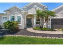 Inviting front entrance with well-maintained landscaping and a covered entryway at 3015 160Th E Ter, Parrish, FL 34219