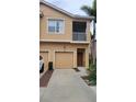 Charming two-story townhome featuring a private garage, screened balcony, and well-maintained exterior at 3784 Parkridge Cir # 22-203, Sarasota, FL 34243