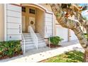 Well-maintained front entrance with concrete steps and white railings that lead to each unit's front door at 7039 Strand Cir # 34-201, Bradenton, FL 34203