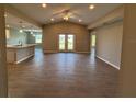 Open-concept living room featuring tile floors, vaulted ceiling, and bright and airy atmosphere at 12089 Mayfair Ave, Port Charlotte, FL 33981