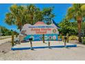 A welcome sign for Holmes Beach on Anna Maria Island is surrounded by palm trees and landscaping at 2402 16Th W St, Palmetto, FL 34221