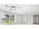 Large windows in the living room offer bright natural light and neighborhood views at 3095 Pinetree St, Port Charlotte, FL 33952