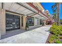 Charming retail shopping front with palm trees and sidewalk at 33 S Palm Ave # 1702, Sarasota, FL 34236
