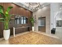 Beautiful lobby area with decorative floors, wood wall features and waiting area at 33 S Palm Ave # 1702, Sarasota, FL 34236