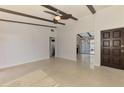 Open living room featuring beamed ceilings and sleek floors at 3599 Bali Dr, Sarasota, FL 34232